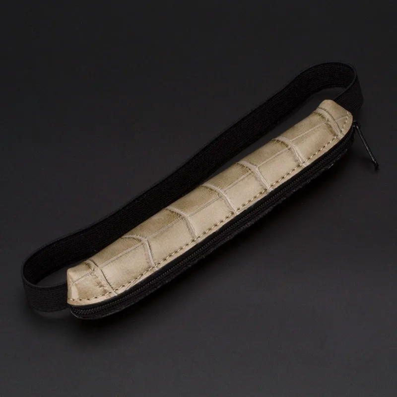 Long slim PU leather pencil case in beige grey, black, black crocodile pattern, and brown crocodile pattern.