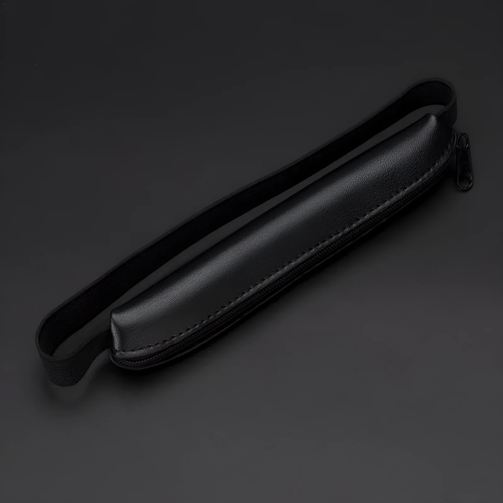 Long slim PU leather pencil case in beige grey, black, black crocodile pattern, and brown crocodile pattern.