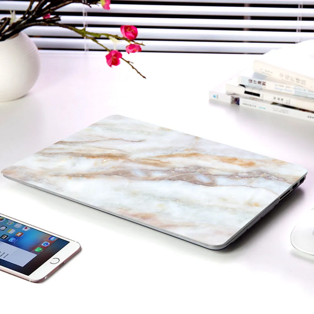 Plastic marble finish protective case for a MacBook laptop in light blue colour.