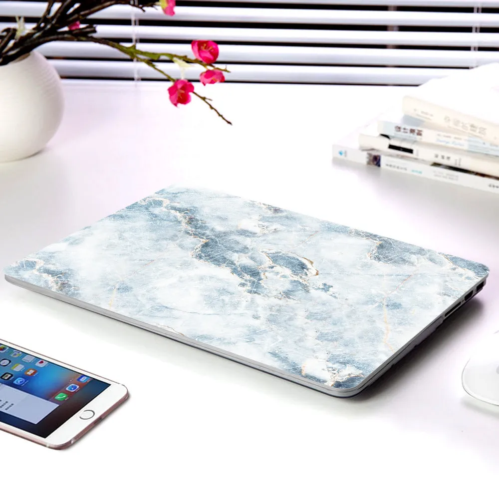 Plastic marble finish protective case for a MacBook laptop in light blue colour.