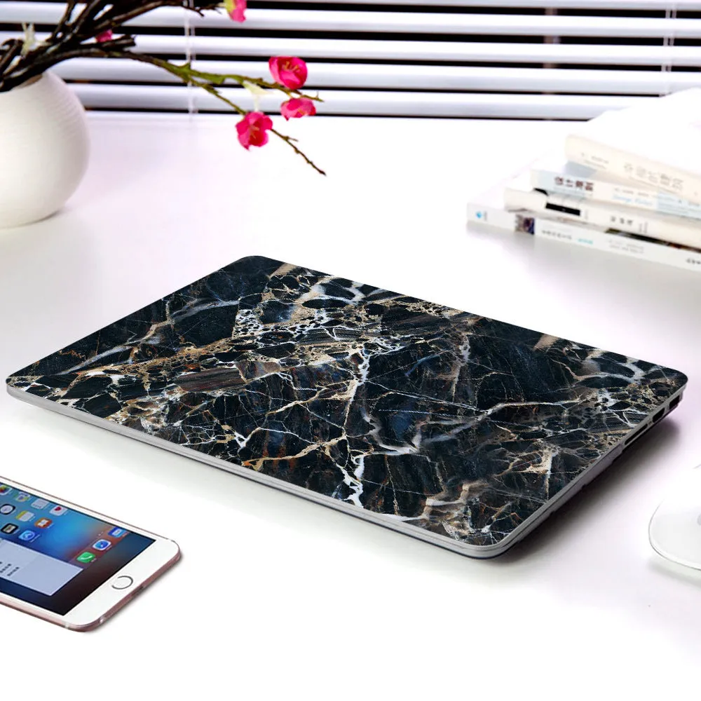 Plastic marble finish protective case for a MacBook laptop in light blue colour.