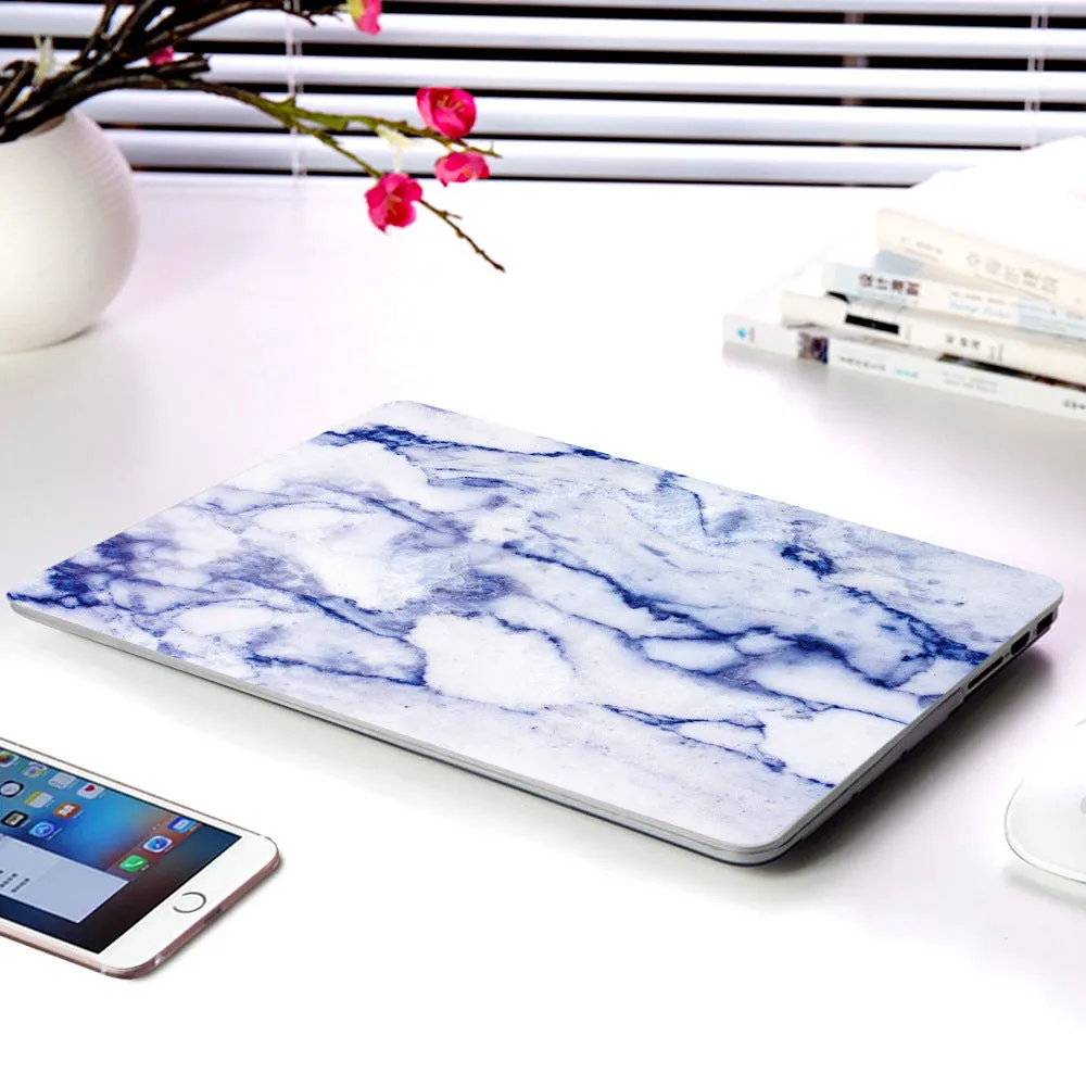 Plastic marble finish protective case for a MacBook laptop in light blue colour.