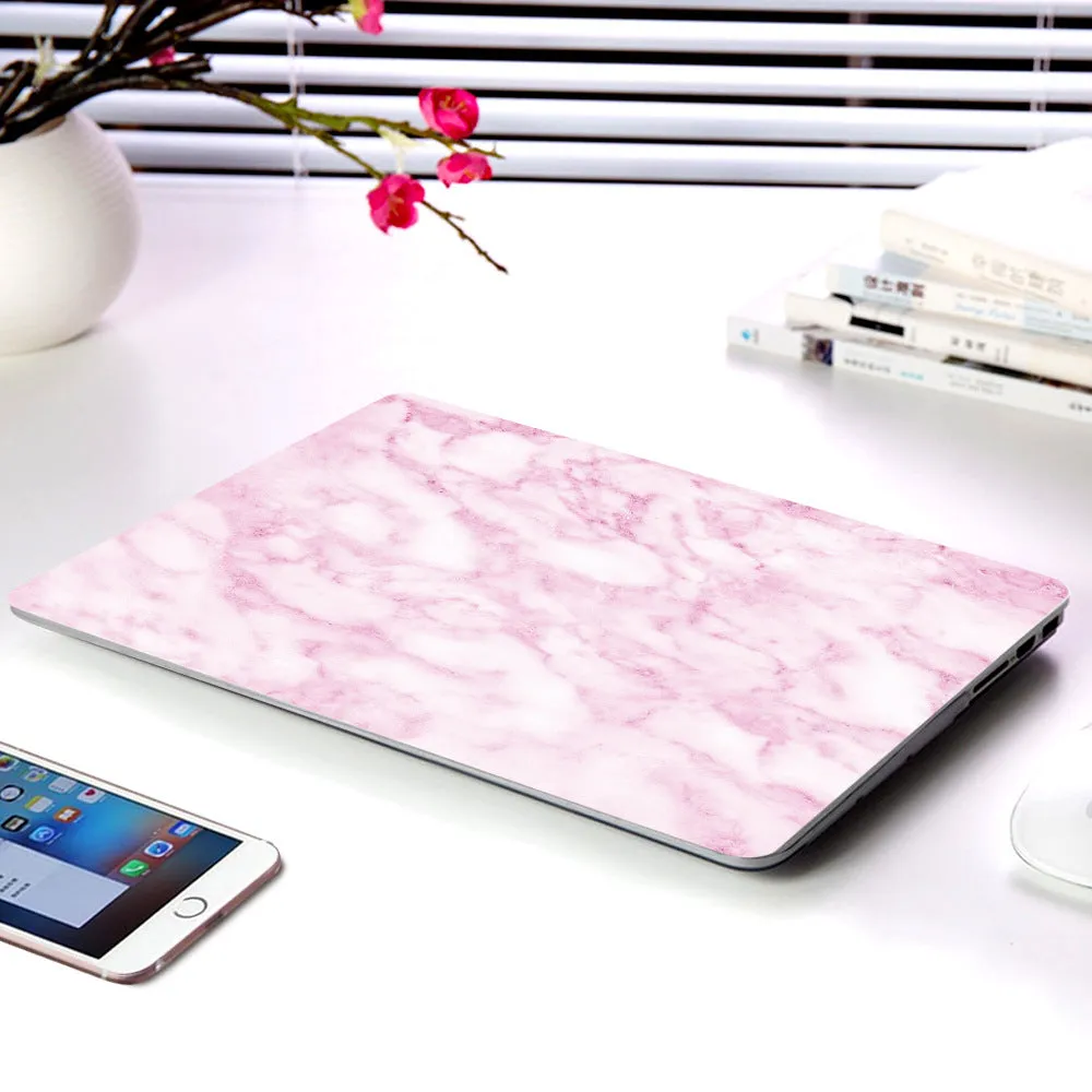 Plastic marble finish protective case for a MacBook laptop in light blue colour.