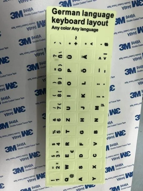 Yellow glowing PVC keyboard stickers with Arabic, Thai, Hebrew, French, Italian, and German language characters