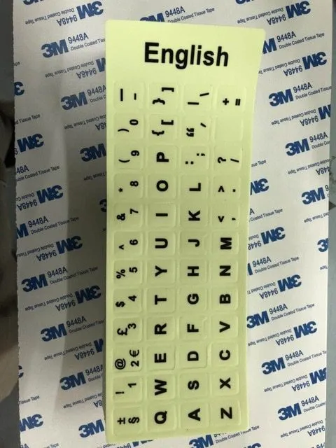 Yellow glowing PVC keyboard stickers with Arabic, Thai, Hebrew, French, Italian, and German language characters
