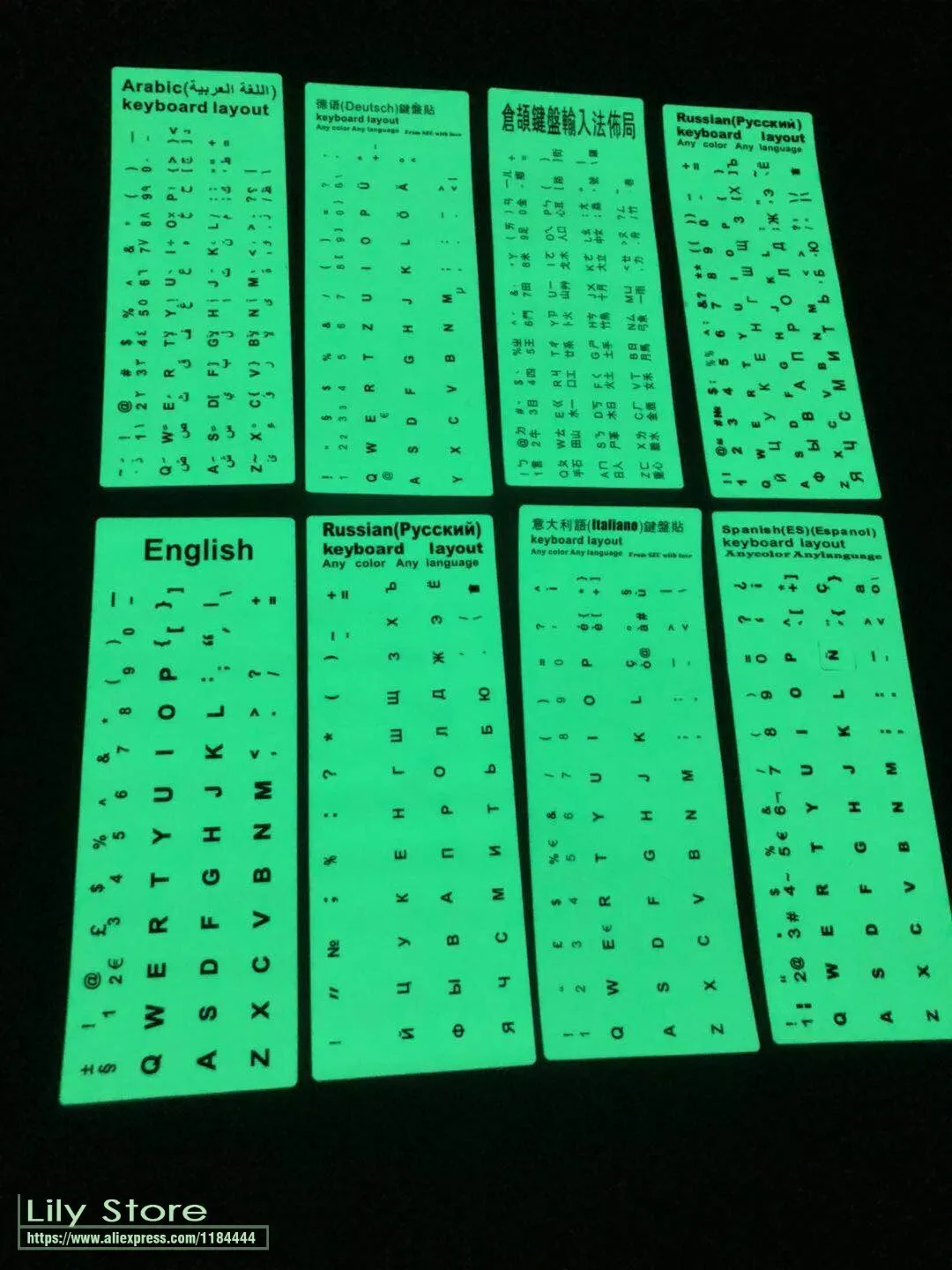 Yellow glowing PVC keyboard stickers with Arabic, Thai, Hebrew, French, Italian, and German language characters