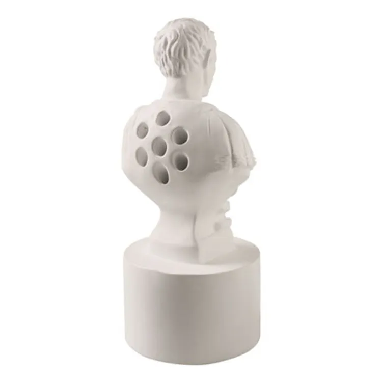 White synthetic resin American creative character pen holder on a desk