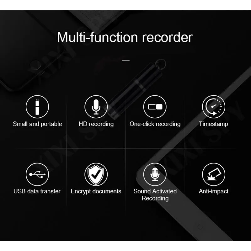 Black metal voice recorder with headset on a table