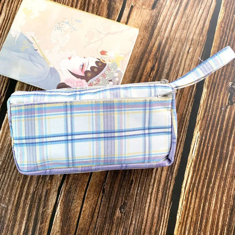 Square double-layer canvas stationery bag in a red stripe grid pattern.