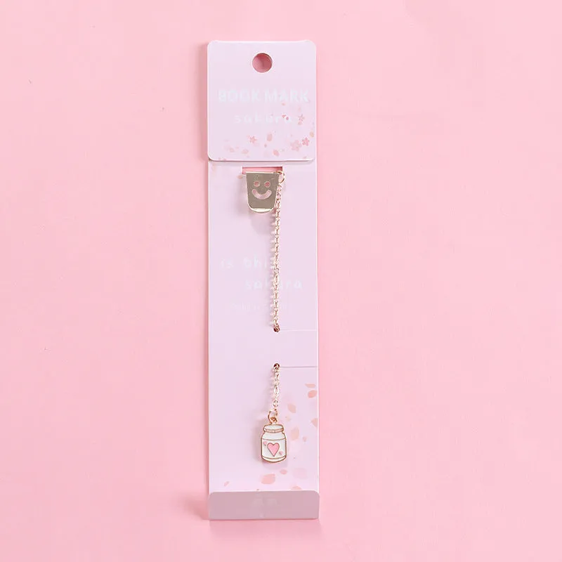 Alloy metal bookmark with cartoon pendant designs including panda, rocket and unicorn variations