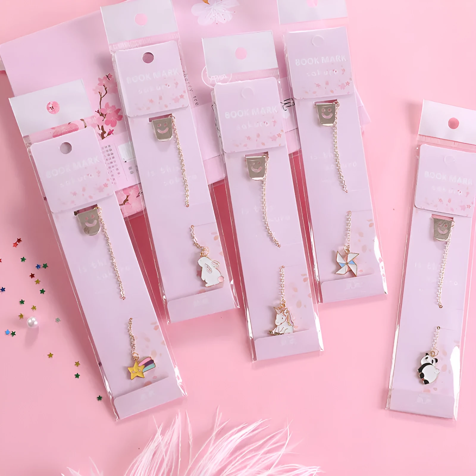 Alloy metal bookmark with cartoon pendant designs including panda, rocket and unicorn variations