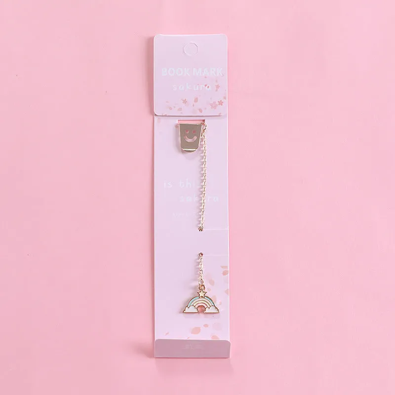 Alloy metal bookmark with cartoon pendant designs including panda, rocket and unicorn variations