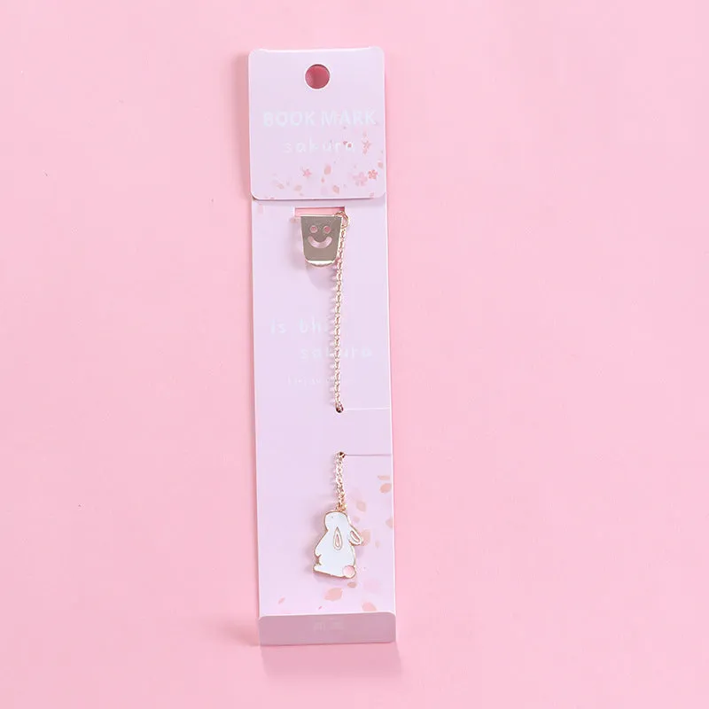 Alloy metal bookmark with cartoon pendant designs including panda, rocket and unicorn variations