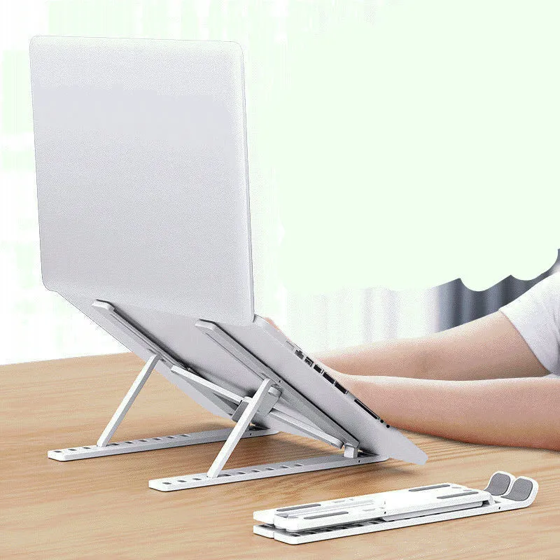 Black folding desktop bracket adjusted to a medium height angle on a wooden desk.