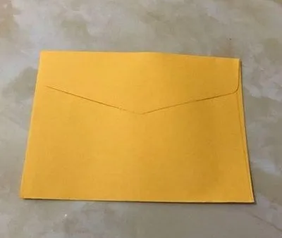 Pack of ten mini coloured paper envelopes in various shades, sized for business cards.
