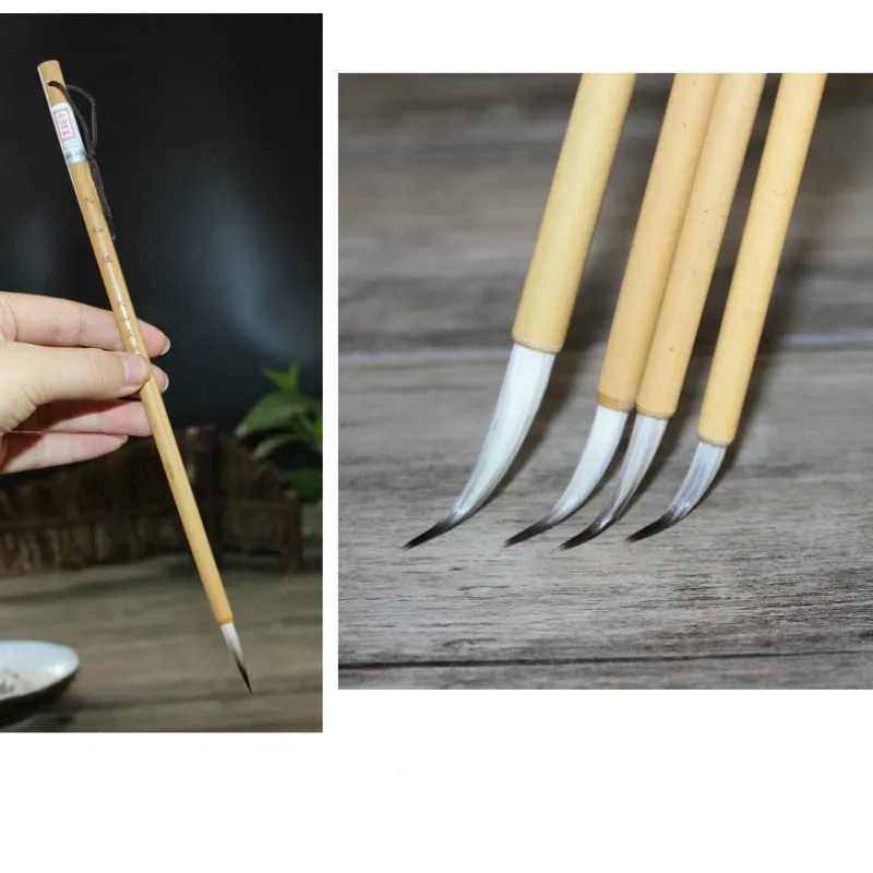 Set of four Chinese calligraphy brushes with gold pine branch design and mixed wolf hair and wool bristles