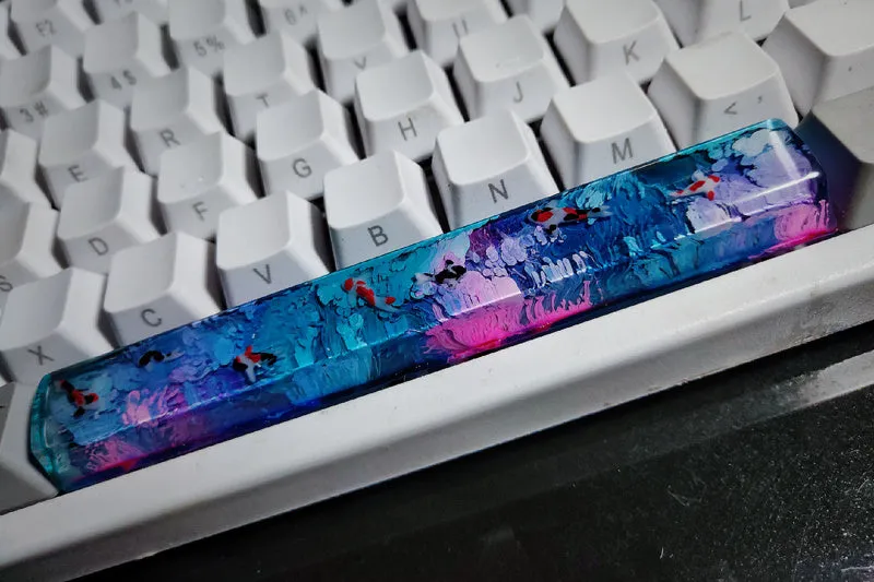 Handcrafted resin keycap with 3D koi fish scenery for Cherry MX mechanical keyboards.
