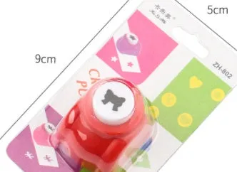 Children's plastic embossing craft kit with device and 20 embossing plates including heart, star, and elephant designs.