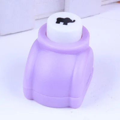 Children's plastic embossing craft kit with device and 20 embossing plates including heart, star, and elephant designs.