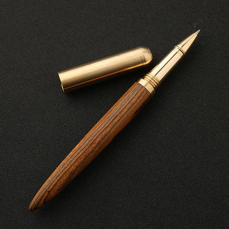 Brass and solid wood signature pen showing wood grain and metal components
