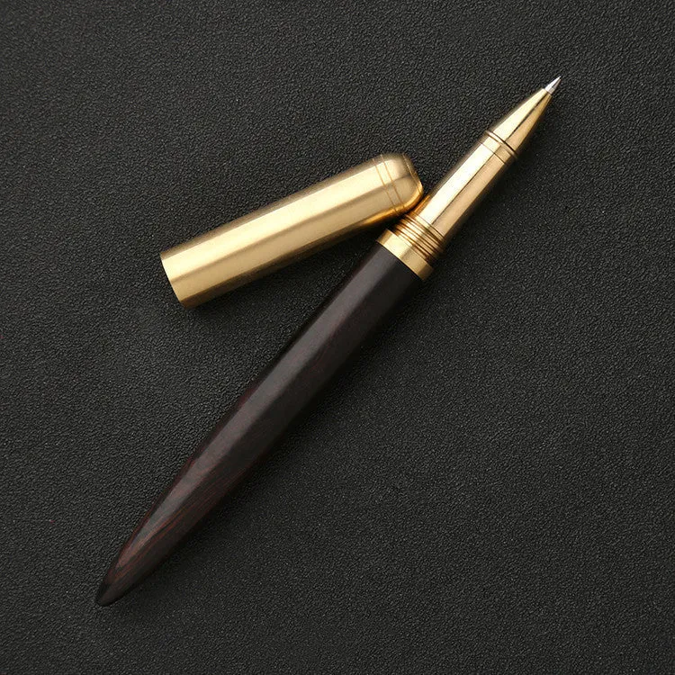 Brass and solid wood signature pen showing wood grain and metal components