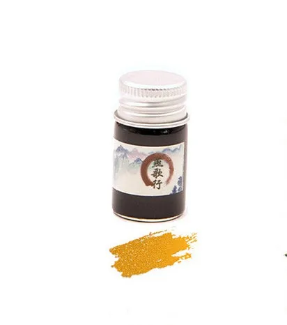 Set of six small glass bottles of gold powder dipping pen ink in different colours.