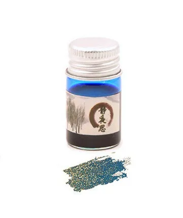 Set of six small glass bottles of gold powder dipping pen ink in different colours.