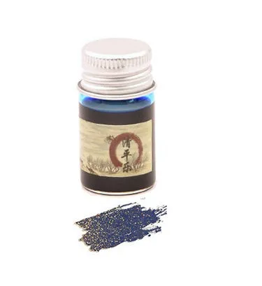 Set of six small glass bottles of gold powder dipping pen ink in different colours.