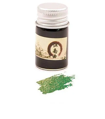 Set of six small glass bottles of gold powder dipping pen ink in different colours.