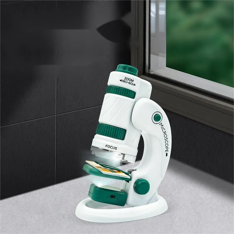 Portable plastic microscope with specimen slides in white-green colour scheme