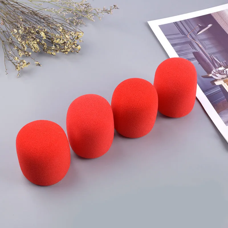 Four multicoloured foam microphone windshields for handheld stage microphones