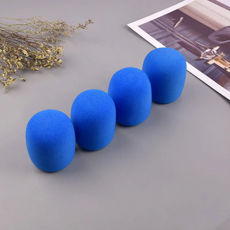 Four multicoloured foam microphone windshields for handheld stage microphones