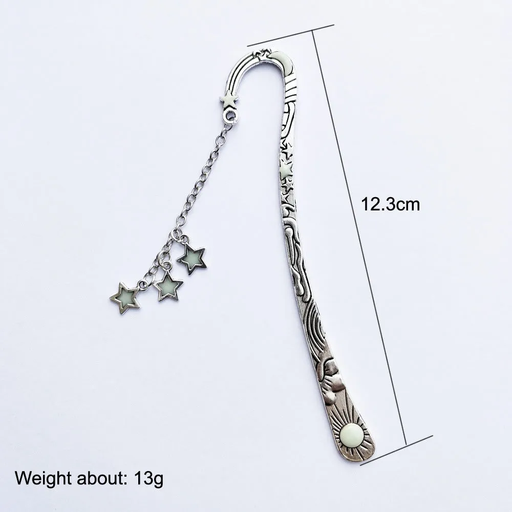 Retro five-pointed star glowing metal bookmark with celestial patterns in ancient silver or bronze finish