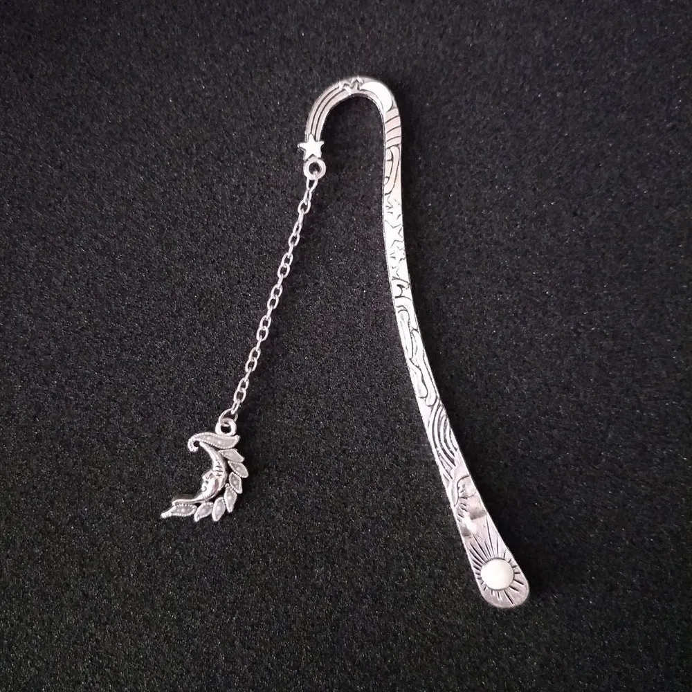 Retro five-pointed star glowing metal bookmark with celestial patterns in ancient silver or bronze finish