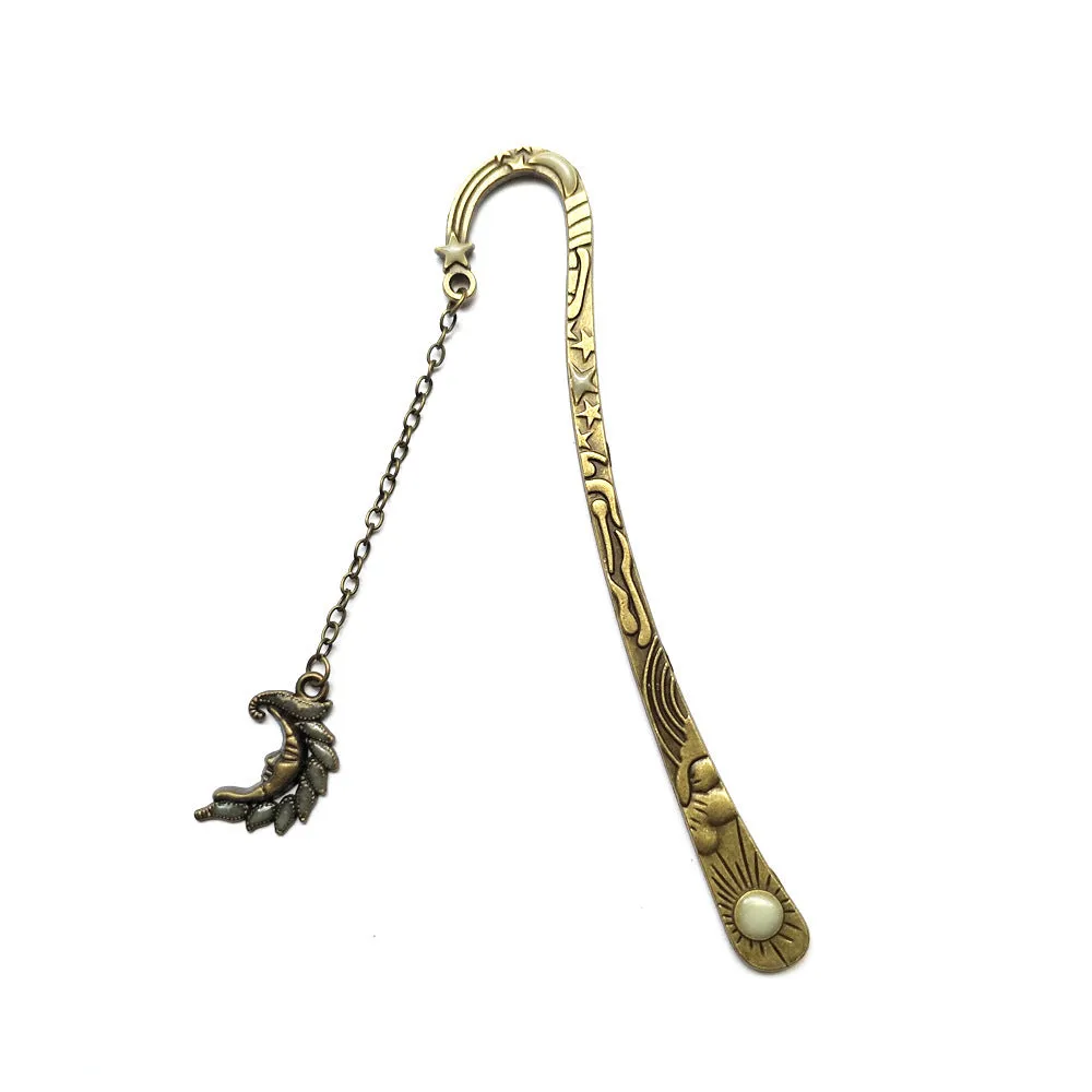 Retro five-pointed star glowing metal bookmark with celestial patterns in ancient silver or bronze finish