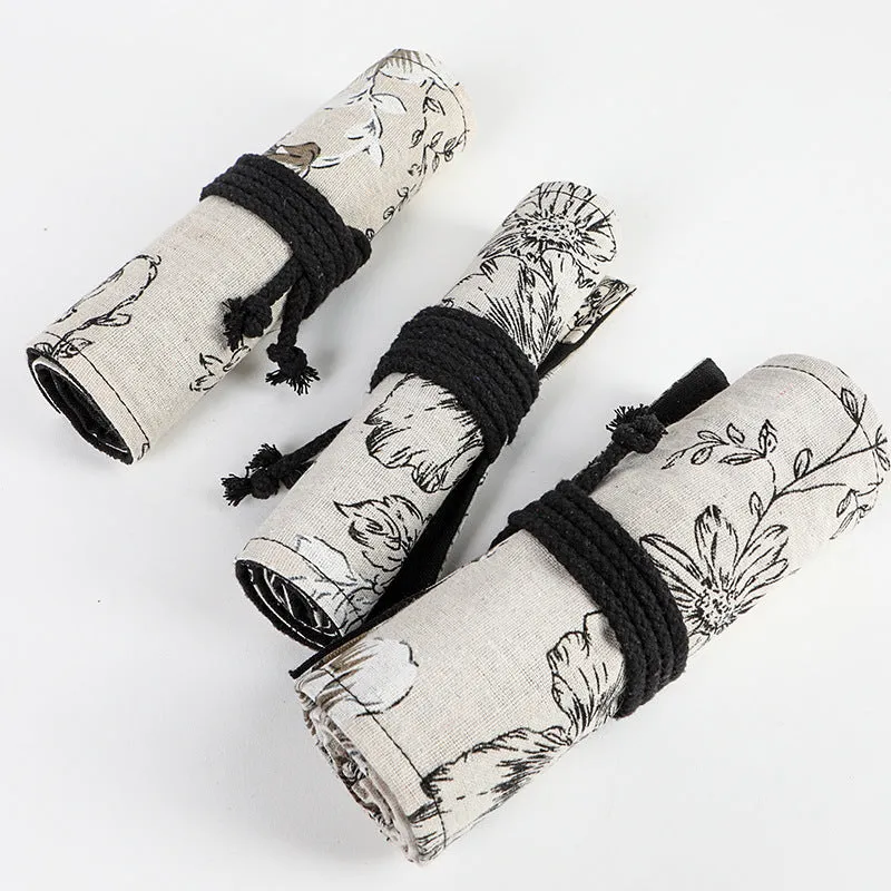 Black Peony printed canvas pencil roll bag open to show 24 or 72 holes for pencils on cotton hemp fabric.