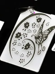 Plastic folding cake decorating mould showing windmill and five-pointed star design options