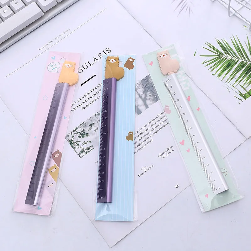 30 centimetre long silver aluminum ruler with black printed measurement scales.