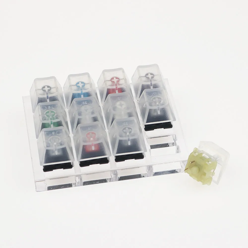 White Cherry mechanical keyboard switch tester showing twelve different MX switches.