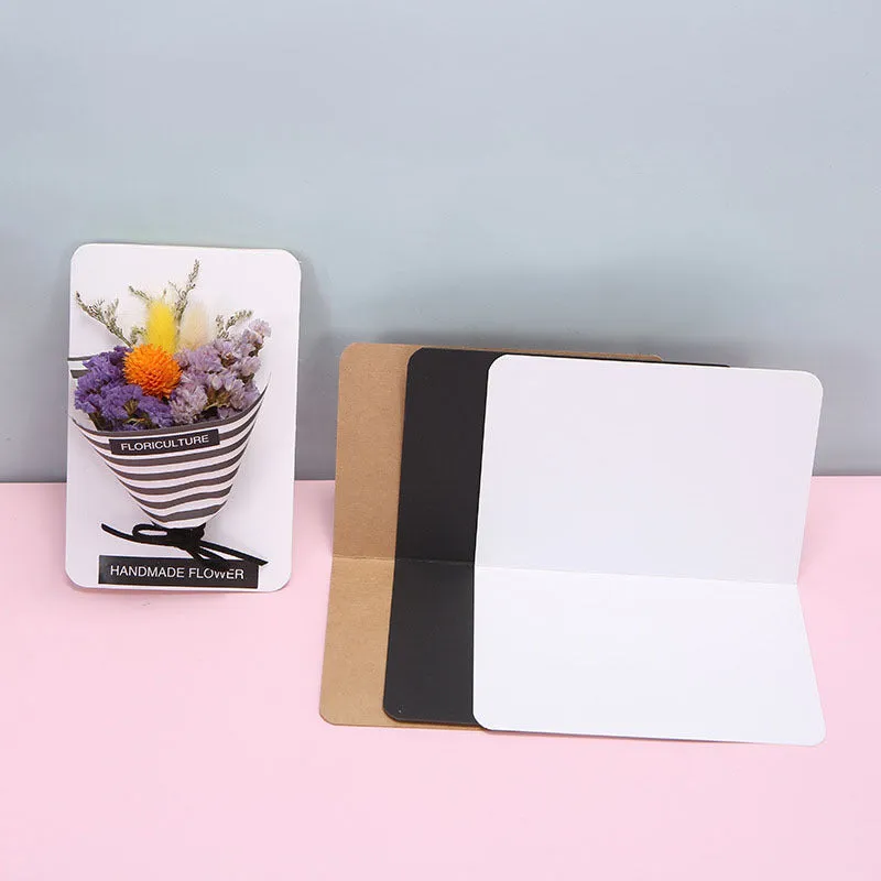 A pack of 100 blank folded kraft paper cards in 10x15cm size, shown in black, brown, and white colours.