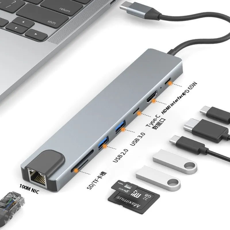 Silver USB-C 7-in-1 expansion dock with HDMI, USB ports, card slots, Ethernet, and a 15 cm cable.
