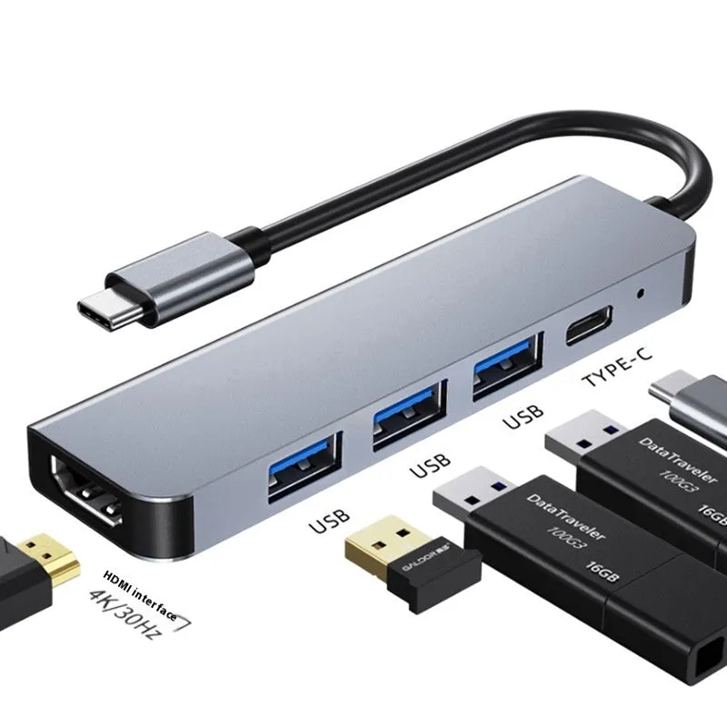 Silver USB-C 7-in-1 expansion dock with HDMI, USB ports, card slots, Ethernet, and a 15 cm cable.