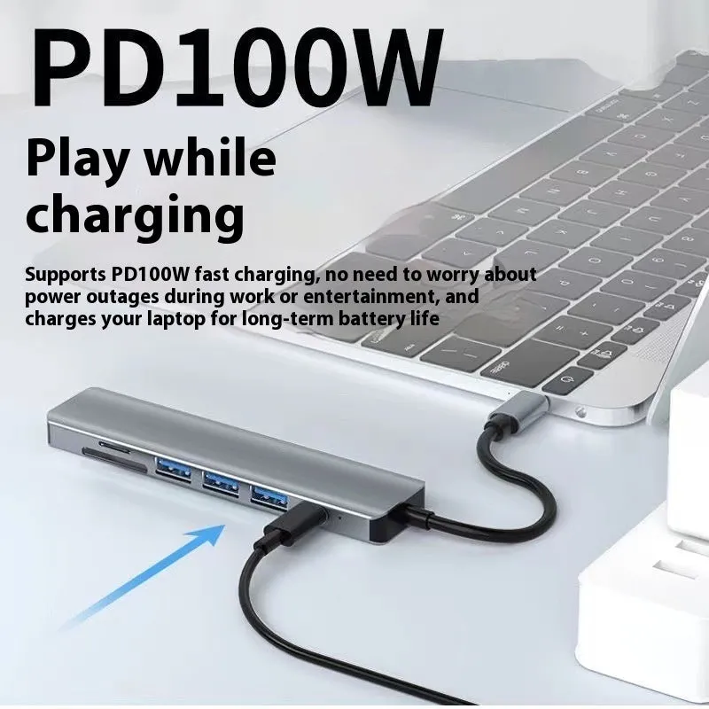 Silver USB-C 7-in-1 expansion dock with HDMI, USB ports, card slots, Ethernet, and a 15 cm cable.