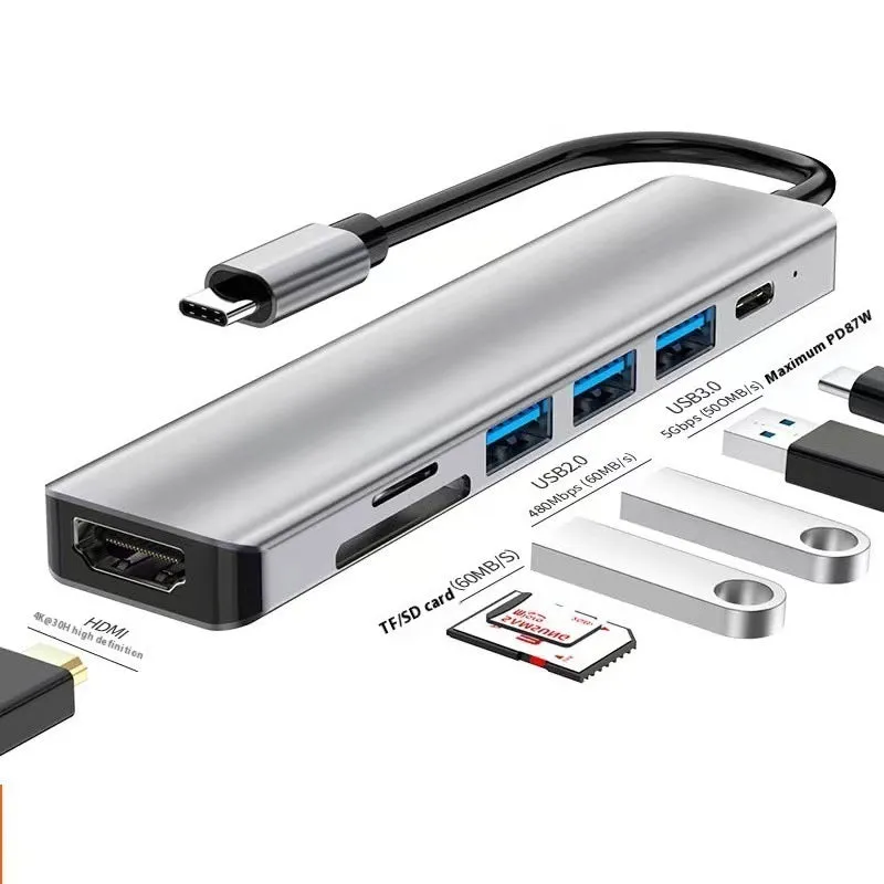 Silver USB-C 7-in-1 expansion dock with HDMI, USB ports, card slots, Ethernet, and a 15 cm cable.