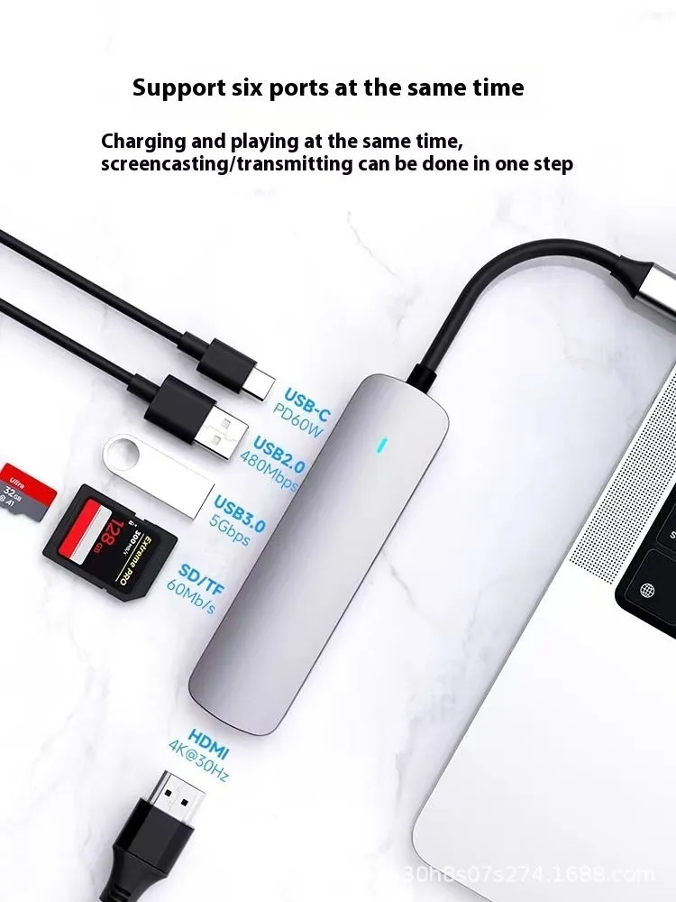 Silver USB-C 7-in-1 expansion dock with HDMI, USB ports, card slots, Ethernet, and a 15 cm cable.