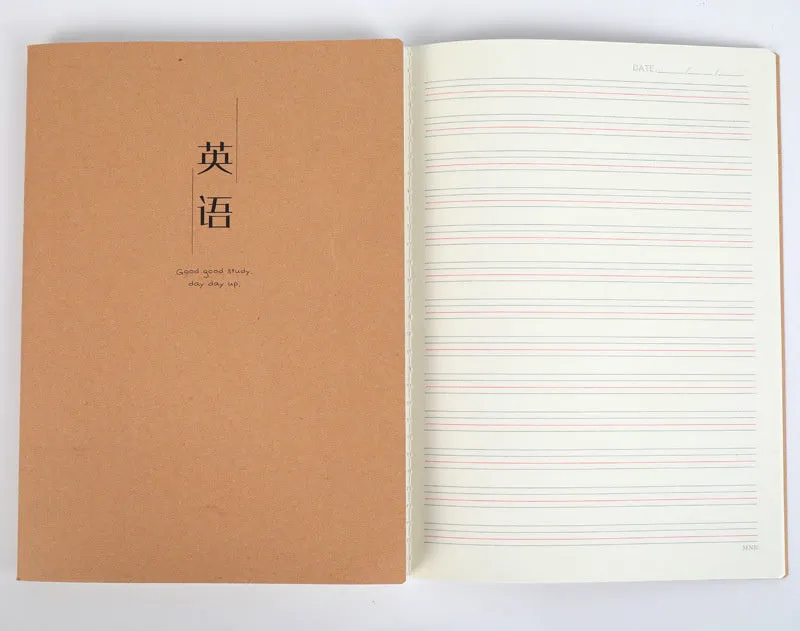 Beige softcover thread-bound notebook in 16K size lying open on a table, showing grid paper inside.