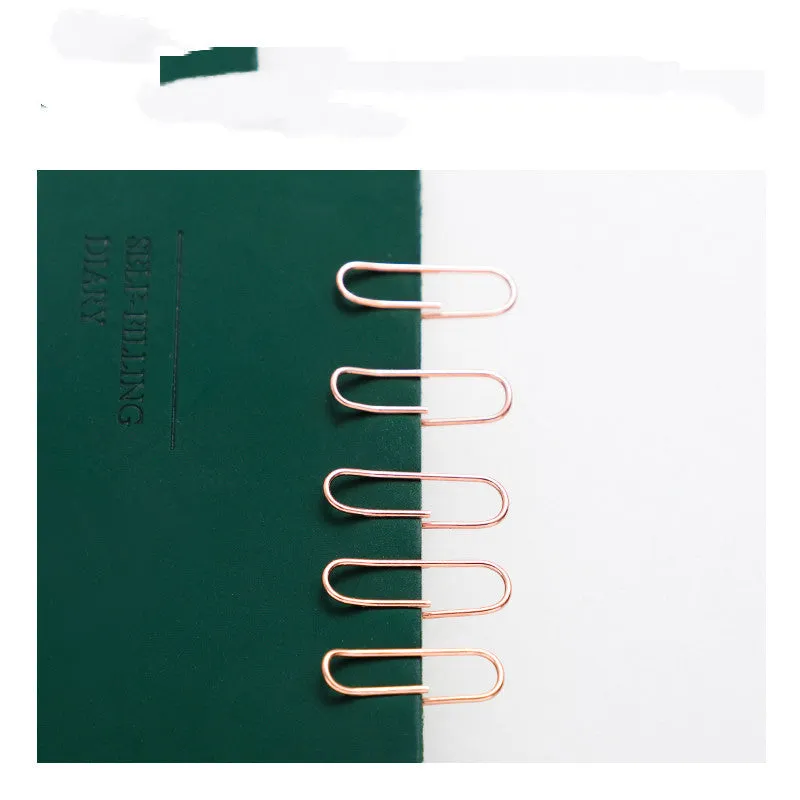Rose gold heart-shaped paper clips with steel core construction measuring 28mm each