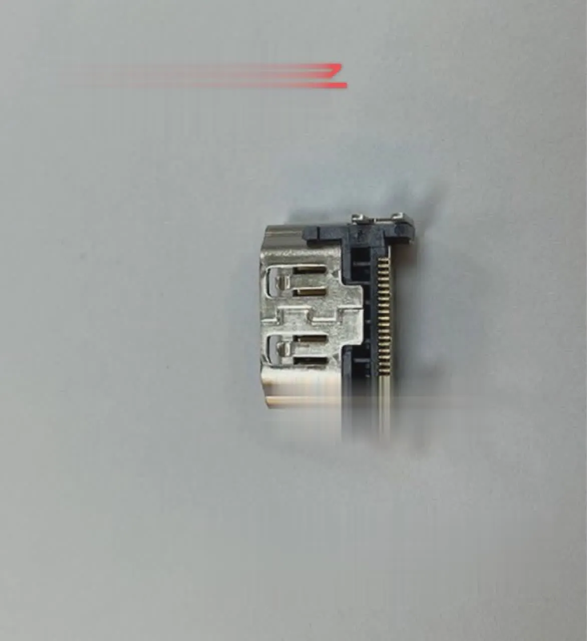 Silver metal HDMI host interface socket connector with mounting holes.