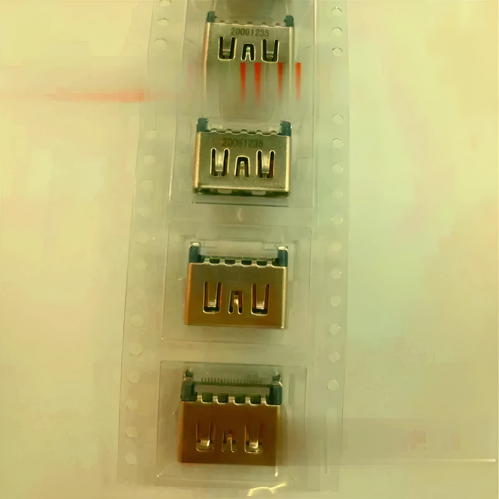 Silver metal HDMI host interface socket connector with mounting holes.