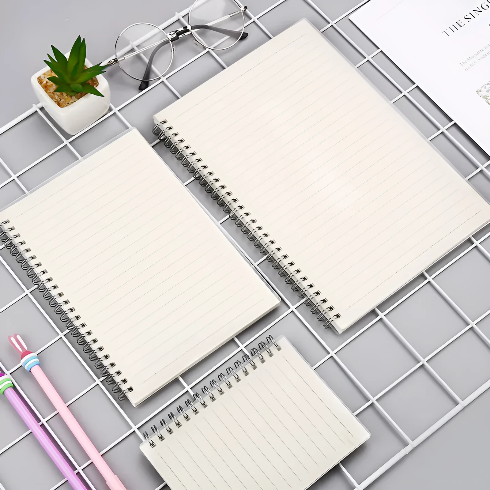 Creative coil-bound notebook open showing grid dot matrix pages, with PP matte cover in A5 size.